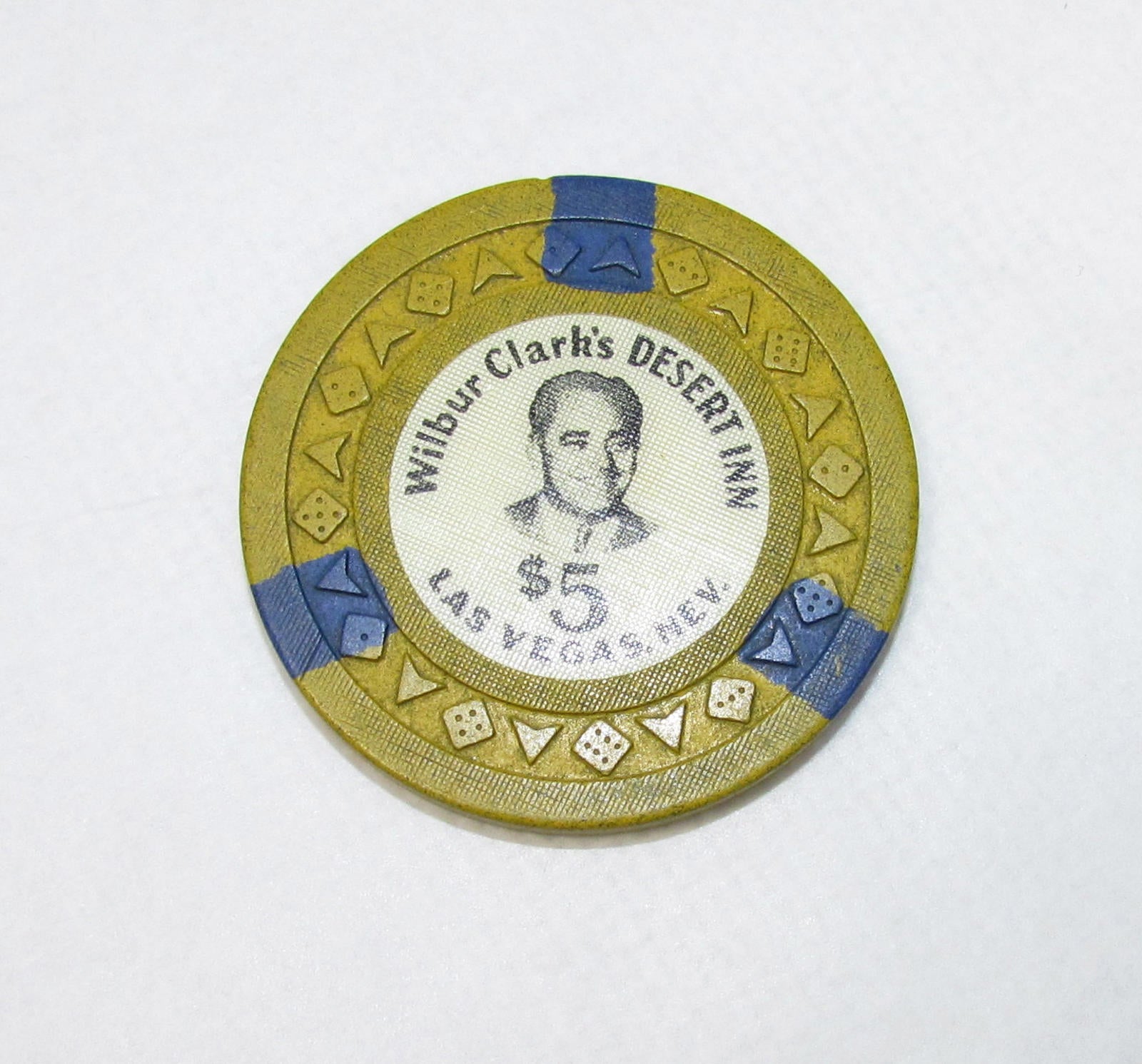 Las Vegas, NV Casino Chip: Wilbur Clark’s Desert Inn $5 Arodie Mustard / Blue R9
